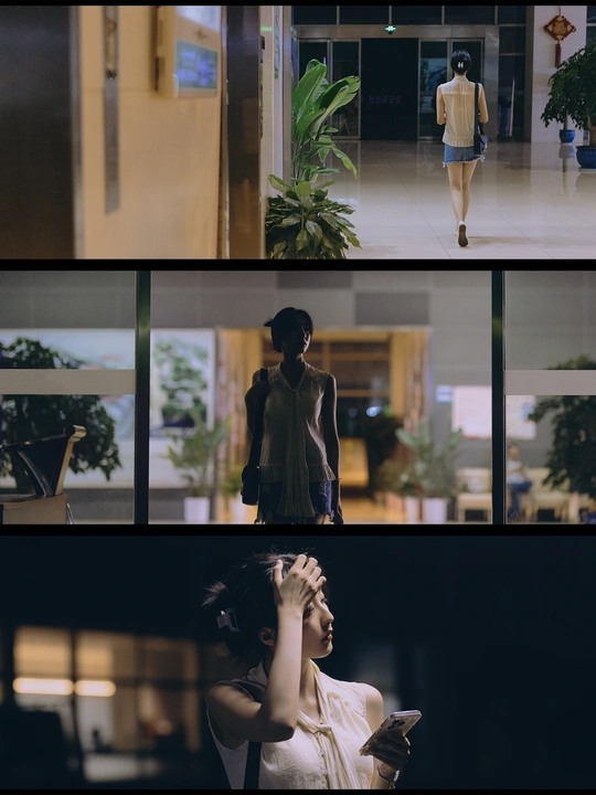 一位穿着连衣裙的女人站在建筑物内部