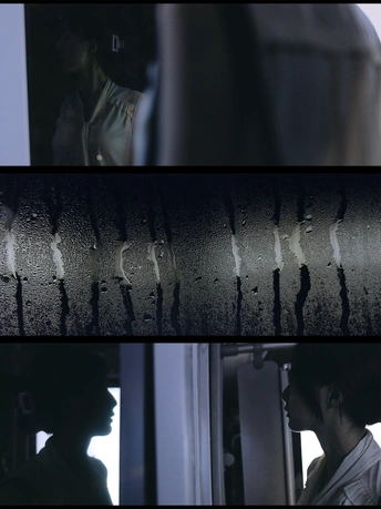 一位女士正在火车窗口向外看