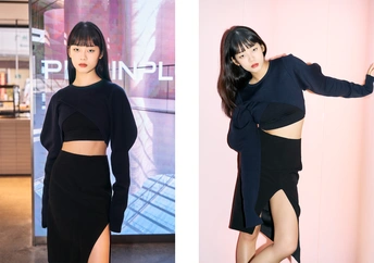 一位穿着黑色上衣和黑色裙子的女性正在为拍照姿势