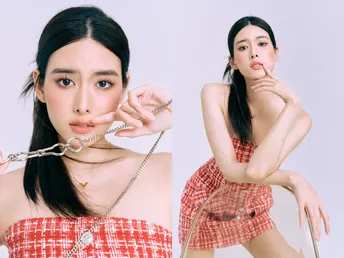 一位穿红白连衣裙带着链子的女人