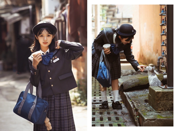 一些年轻女孩穿着校服抱着一个包站在一只猫旁边