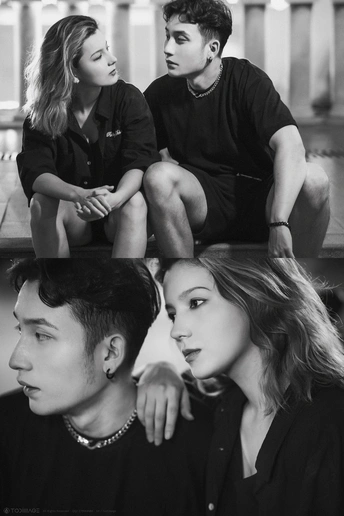 一个人坐在一个女孩和一个男孩旁边