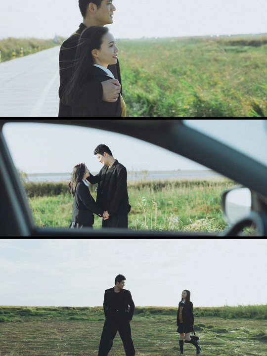 一个人和一个女人并排走在一条路上 手牵着手 注视着一辆在田地里行驶的车。