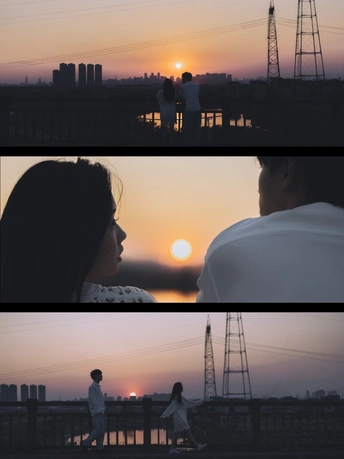 夕阳西下 一位男士和女士站在落日背后。