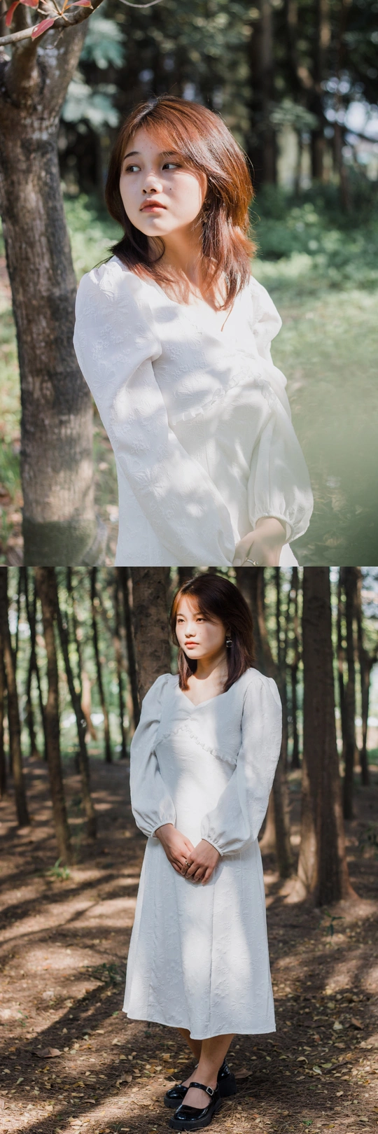 一个穿着白色连衣裙的年轻女子站在树林里