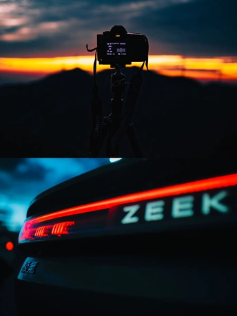 夕阳下的三脚架相机 背景是山脉。