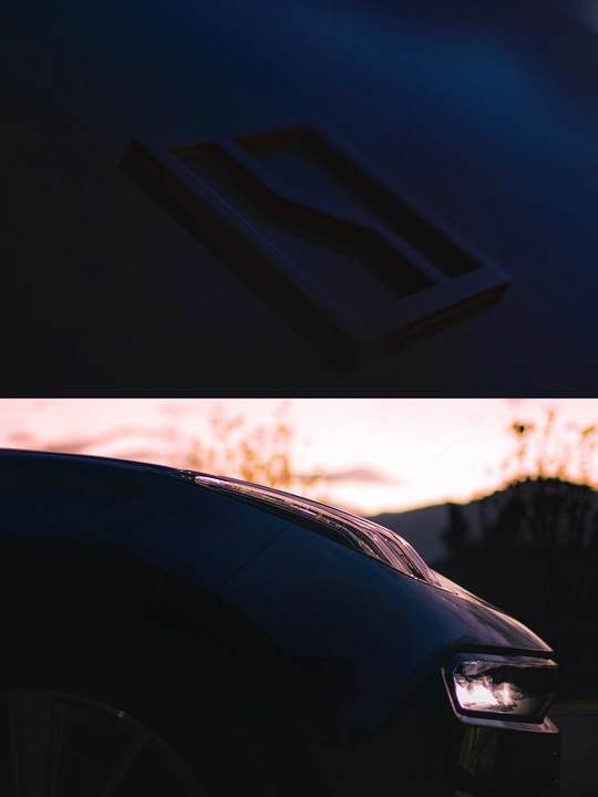 汽车引擎盖上日出的画面