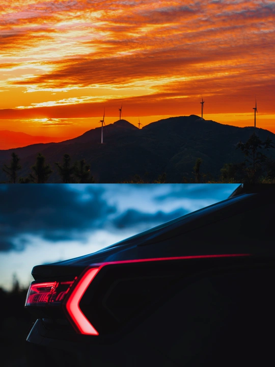 夕阳下有山和云 前面有一辆带红灯的车。