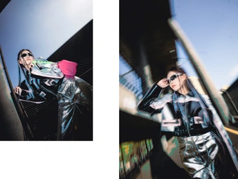 一张女性穿着黑色站在滑板上的桥上的照片