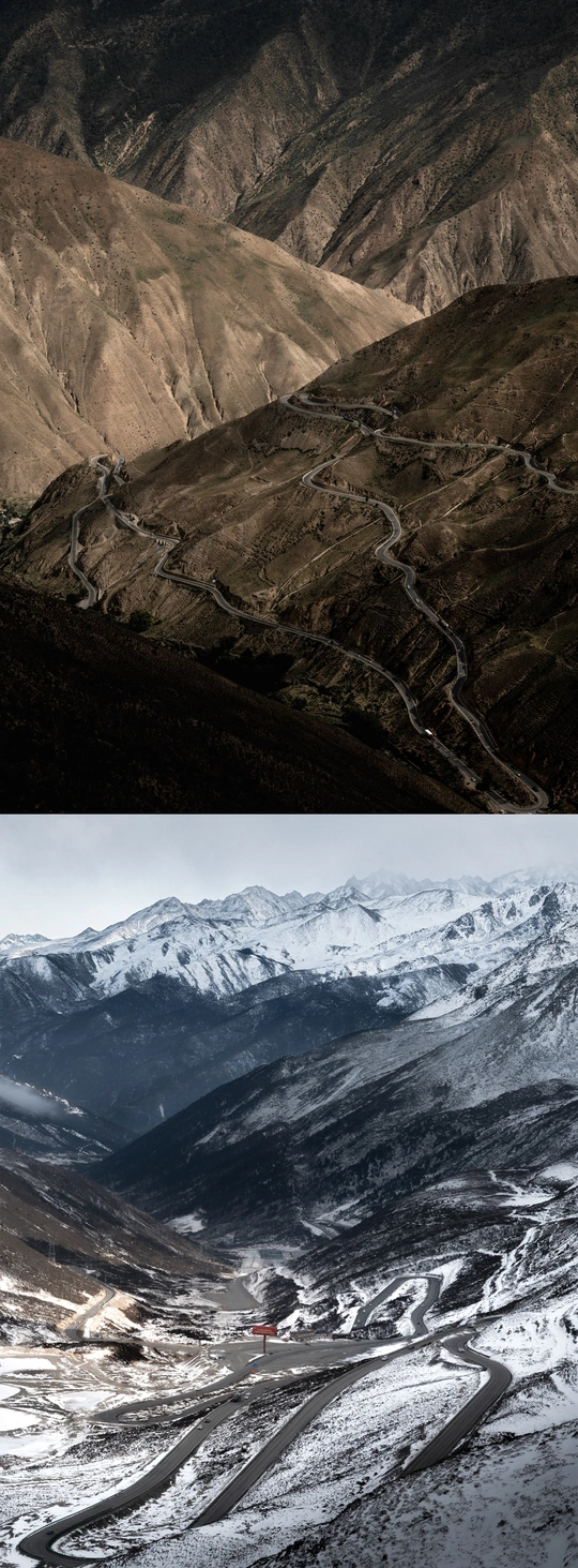 山谷中的公路和背景中的山脉的图片