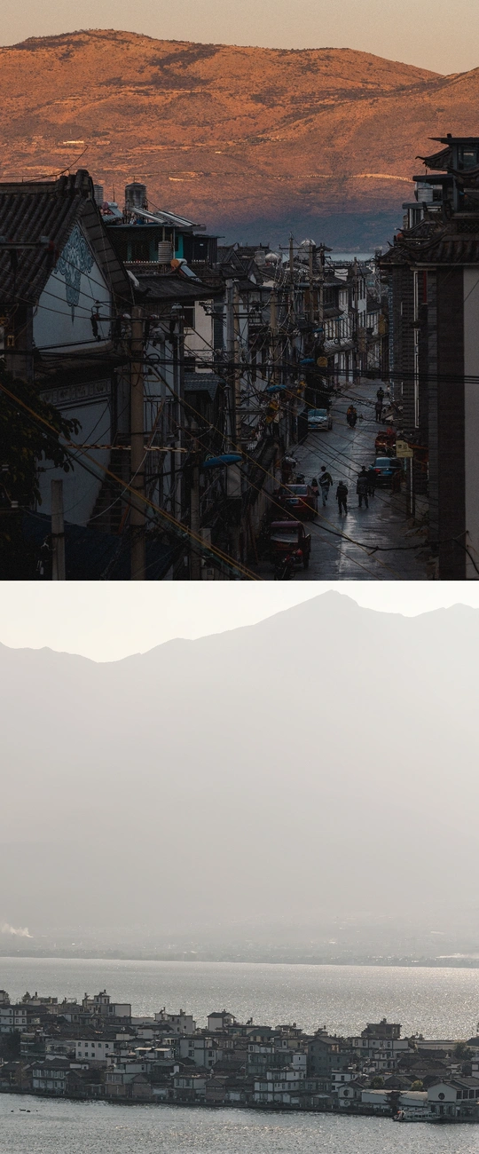 图片的左侧展示了一片广阔的水域 其中有许多船只 背景中有一座山。