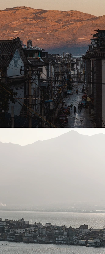图片的左侧展示了一片广阔的水域 其中有许多船只 背景中有一座山。