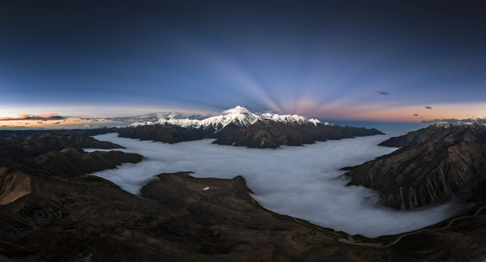 sunrise over the clouds and mountains