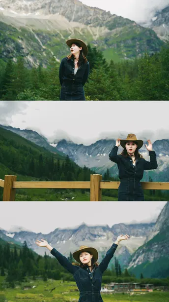 戴帽子站在围栏旁边 背景是山脉的女人