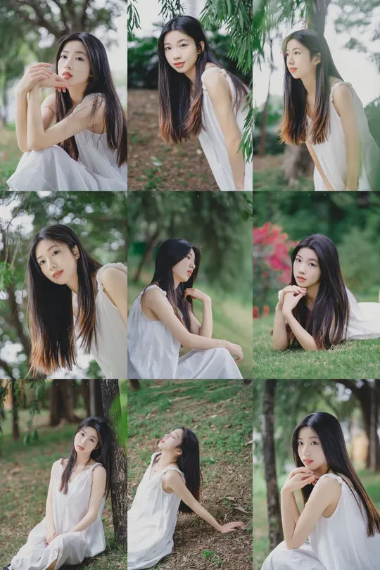 一位穿着白色连衣裙的美女 头发披肩