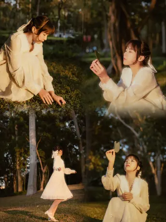 公园里的一幅女人和一个小女孩的场景