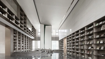 一个现代化的建筑中的一个大型房间 地板上有书架。