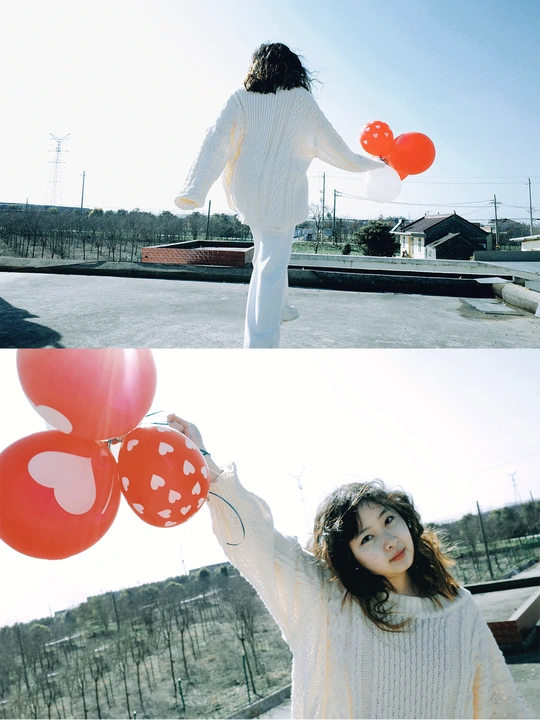 一张照片 小女孩穿白色衣服 手里拿着红气球