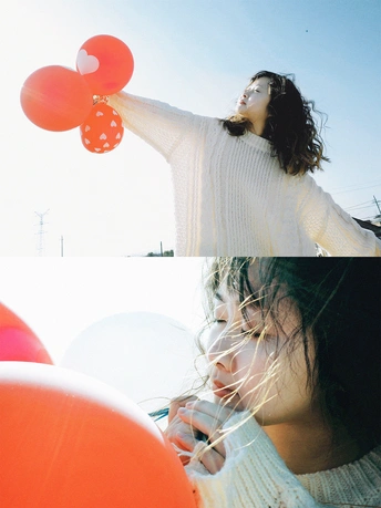 穿毛衣的小女孩拿着红气球