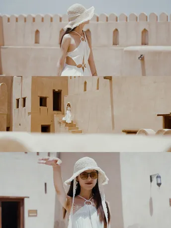 一位穿着白色连衣裙和帽子女士