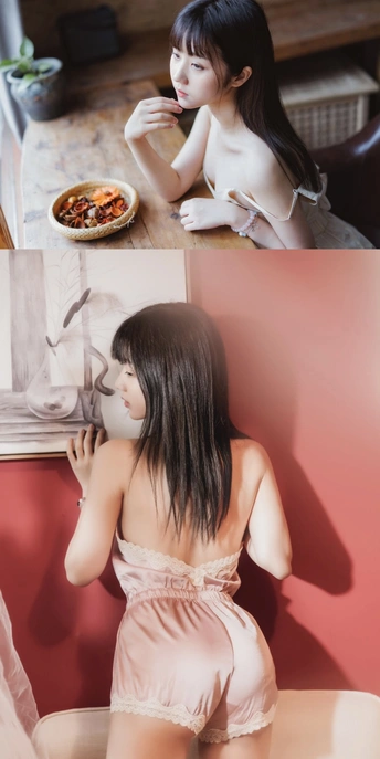 一位年轻女子坐在桌子旁吃食物的画面