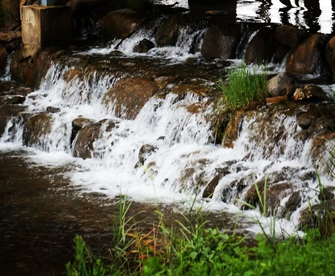 a small waterfall in a stream of water