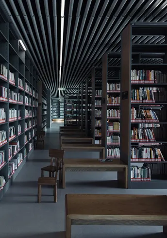 一个大房间 里面摆满了书架 上面堆满了书籍。