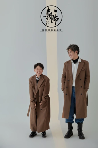 a person standing next to another person in a coat