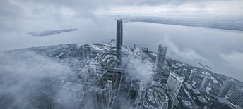 从高空俯瞰城市中的一栋高楼的顶部照片