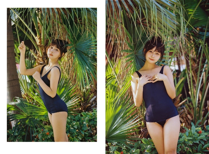 一位穿着黑色泳装的女士站在棕榈树森林中