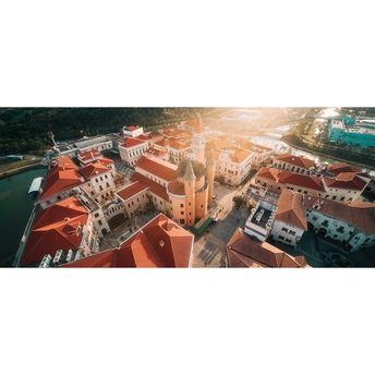 panoramic photo of an old town with red buildings