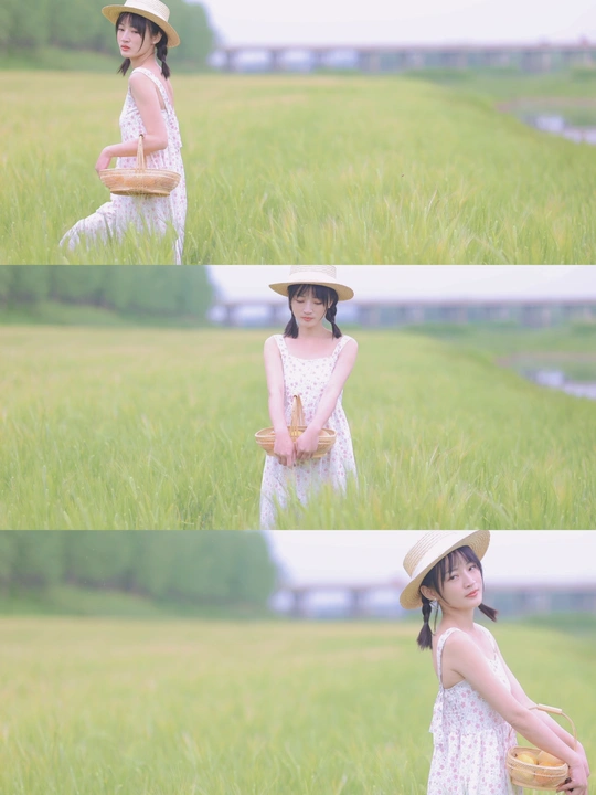 一位穿着白色连衣裙和帽子站在田野里的年轻女子