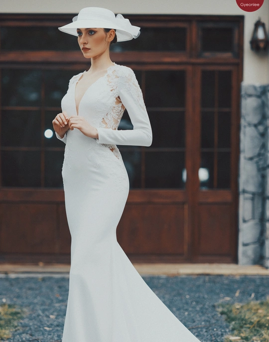 一位穿着白色婚纱 拖尾和礼帽的女士 来自该系列。