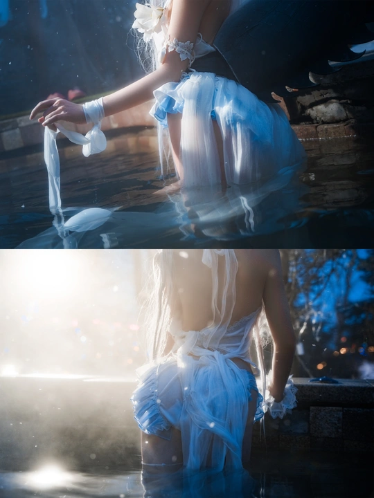 一位穿白裙子的女人在水里