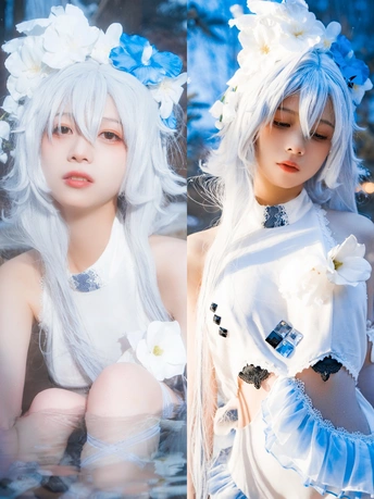 一些穿白裙子的女孩 她们的头发上插着蓝色的花