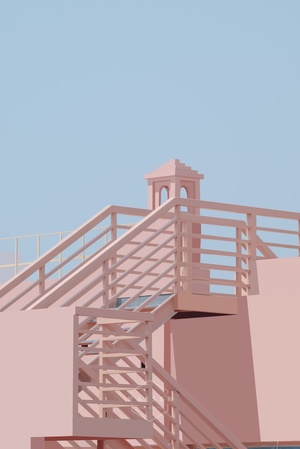 一座粉色建筑 配有一座塔和楼梯 背景是蓝天。