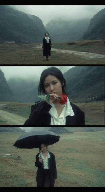 一张黑白照片 一个年轻女孩拿着花和一把黑伞