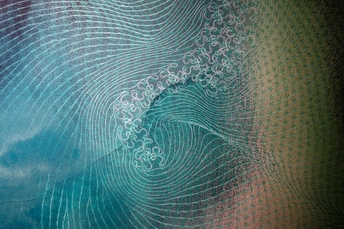 a pattern of waves against a blue sky