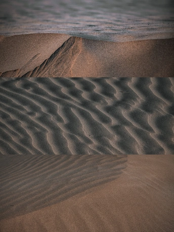 风、水、波浪和沙子在沙滩上形成图案。