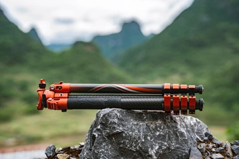 a water hose sitting on top of a rock