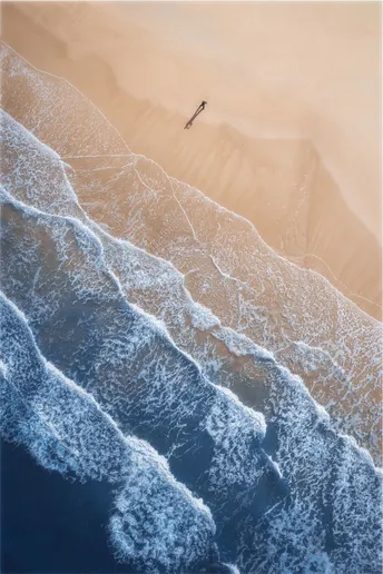 空中俯瞰一艘飞越沙滩和海洋波浪的船