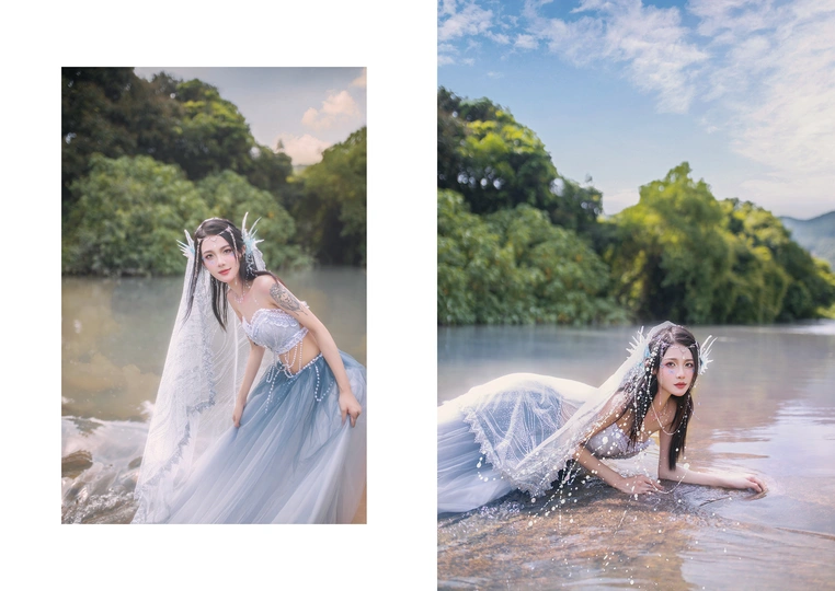 一位穿着蓝色连衣裙的美女在水中的河流中的画面