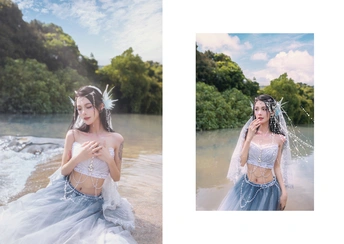 一位穿着蓝色连衣裙的女士与一幅河的图片相邻的照片